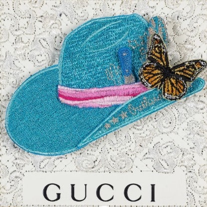 Embroidered turquoise cowboy hat with monarch butterfly on white Gucci lace, mixed media by Stephen Wilson