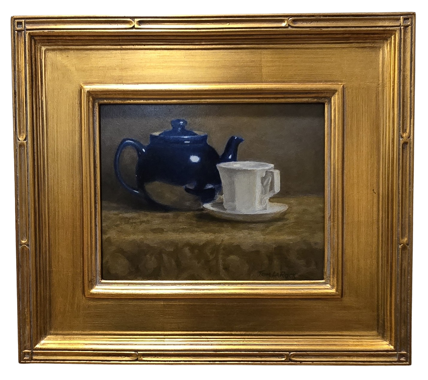 Oil painting of a dark blue teapot with a white cup and saucer in a gold frame by Tom LaRock