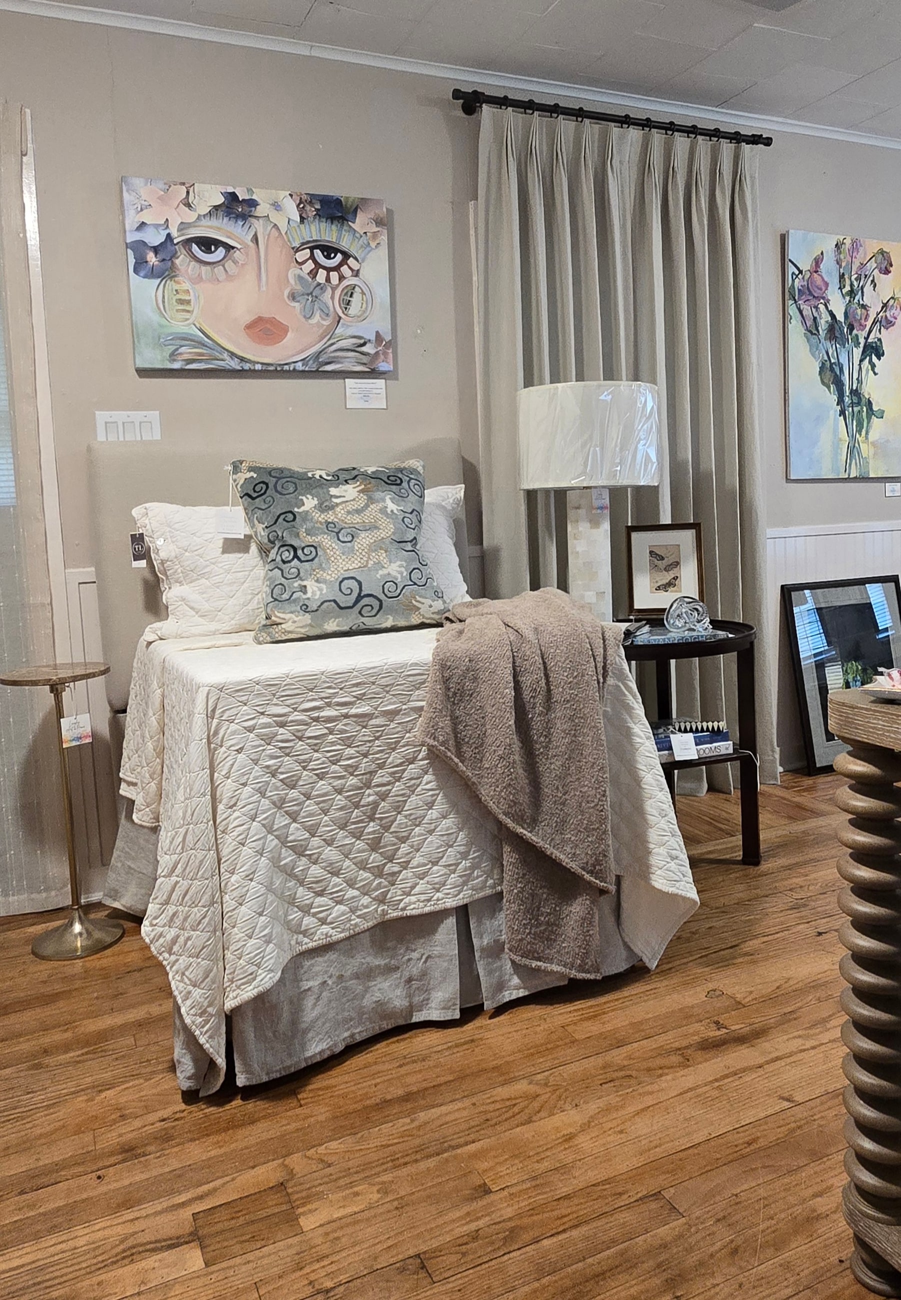 Bedding and custom drapery display styled by Langley Art & Home