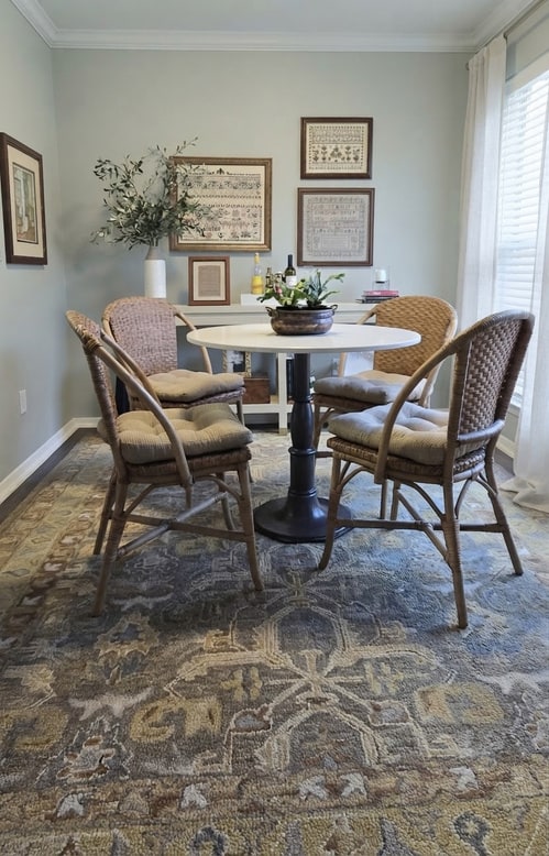 The breakfast area, finished with the bistro table and rattan chairs.